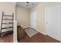 Bright entryway features beautiful flooring, storage bench, and ample closet space at 30 Holly Berry Ln, Durham, NC 27703