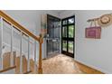 Inviting entryway with open door showing wood floors and staircase at 3743 Yorktown Pl, Raleigh, NC 27609