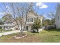 View of a lovely two-story house with a well-kept lawn and beautiful landscaping at 3905 Joe And Ruth Lee Dr, Raleigh, NC 27610