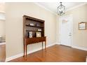 Traditional entryway with hardwood floors, a decorative hutch, and a charming pendant light fixture at 473 Abercorn Cir, Chapel Hill, NC 27516