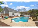 Inviting in-ground pool surrounded by a concrete deck and fencing, perfect for outdoor entertaining at 5720 All Clear Ln, Wendell, NC 27591