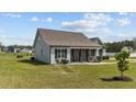 Well-maintained home on a spacious lot featuring manicured lawn and appealing architectural details at 676 Wall Rd, Wendell, NC 27591