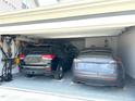 Spacious two-car garage with a durable epoxy floor and plenty of room for storage at 7125 Crested Iris Pl, Durham, NC 27703
