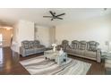 Bright living room with ceiling fan, comfortable seating, and a stylish coffee table at 1102 Dartmouth Dr, Mebane, NC 27302
