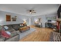 Open living room featuring hardwood floors and a comfortable seating arrangement at 1208 Briarcliff Rd, Burlington, NC 27215