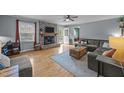 Cozy living room with fireplace, hardwood floors and natural light at 1208 Briarcliff Rd, Burlington, NC 27215