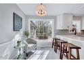 Cozy breakfast nook with large window, barstool seating, and natural light at 1308 Helmsdale Dr, Cary, NC 27511