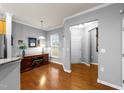 Bright home office area with desk, ample natural light, and hardwood floors at 1404 Palmer Hill Dr, Durham, NC 27703