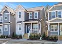 Charming two-story home featuring a covered porch and varied exterior finishes at 146 Weavers Grove Dr, Chapel Hill, NC 27514