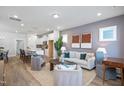 Open-concept living room featuring neutral tones, modern furnishings, and seamless flow to the kitchen and dining area at 146 Weavers Grove Dr, Chapel Hill, NC 27514