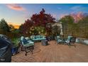 Cozy outdoor space featuring a brick patio, comfortable seating, and a decorative fire pit at 207 Grand Ave, Raleigh, NC 27606