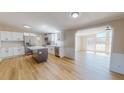 Spacious kitchen features stainless steel appliances, a center island, and ample cabinet space at 210 Holloway Rd, Roxboro, NC 27573