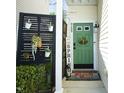 Inviting front entry with green door, potted plants, and decorative accents at 2133 Persimmon Ridge Dr, Raleigh, NC 27604