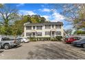Charming exterior view of a two-story townhouse with parking at 2306 Stafford Ave # A, Raleigh, NC 27607