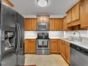 Eat-in kitchen with stainless steel appliances, ample cabinetry and light countertops at 24 High Standard Ln, Angier, NC 27501