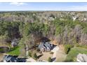 Aerial view of home surrounded by dense trees in a residential neighborhood at 2514 Mcgowan Ct, Wake Forest, NC 27587
