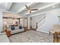 Open-concept living space with hardwood floors, a ceiling fan, and recessed lighting at 332 Tumbling River Dr, Wendell, NC 27591