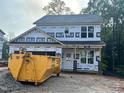 New two-story home featuring traditional architecture and large windows in a construction phase at 35 Fetterbush Way, Clayton, NC 27520