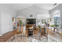 Spacious living room with vaulted ceiling, hardwood floors, and natural light at 406 Southshore Pkwy, Durham, NC 27703