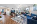 Inviting living room with a cozy fireplace, hardwood floors and comfortable seating at 406 Southshore Pkwy, Durham, NC 27703