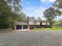 Charming two-story home featuring a spacious front yard and attached two-car garage at 4508 Old Us 421 N, Siler City, NC 27344