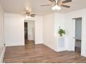 Bright living room with new laminate flooring, white walls and ceiling fans in every room at 540 S Cheatham St, Franklinton, NC 27525