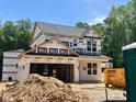 New two-story home featuring a garage and lots of natural light ready for customization and landscaping at 61 Fetterbush Way, Clayton, NC 27520