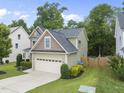 Beautiful two-story home featuring well-maintained lawn and a two-car garage at 622 Lone Pine Loop, Fuquay Varina, NC 27526