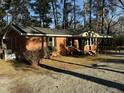 One-story brick home with a ramp, black shutters, and a covered entry for convenience at 640 Crocker Rd, Smithfield, NC 27577