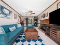 Inviting living room with a fireplace, comfortable blue furniture, and stylish decor on a neutral rug at 7301 Turtleneck Ct, Raleigh, NC 27616