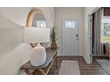 Bright entryway featuring a decorative table, mirror and luxury vinyl flooring at 7750 Michelle Rd, Rocky Mount, NC 27803