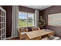 A beautifully staged home office featuring a large window with natural light at 7750 Michelle Rd, Rocky Mount, NC 27803