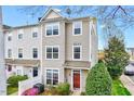 Well-maintained townhome featuring tidy landscaping and a welcoming front entrance at 8641 Neuse Club Ln # 110, Raleigh, NC 27604