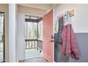 Entryway with a brick floor, coat rack, and view of the porch at 103 Morningside Dr, Carrboro, NC 27510