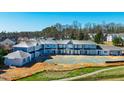 An aerial shows the blue gray townhome building under construction at 110 Bellamy Ln # 107, Chapel Hill, NC 27516
