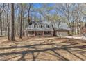 Charming brick home with inviting front porch surrounded by mature trees at 1133 Turner Farms Rd, Garner, NC 27529