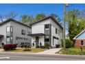 Beautiful modern home featuring a manicured front yard, a stylish driveway, and impeccable curb appeal at 1208 Garner Rd, Raleigh, NC 27610