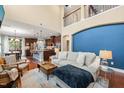 Bright and airy living room with high ceilings, hardwood floors, and a seamless flow to the kitchen at 1524 Catch Fly Ln, Durham, NC 27713