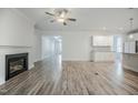 Bright, open-concept living space features a fireplace and modern finishes, ready for personalized touches at 185 W Amber Oak Dr, Selma, NC 27576