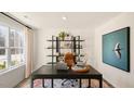Home office features a sleek desk, stylish shelving, and plenty of natural light at 201 Olive Branch St, Sanford, NC 27332