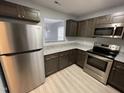 Well-appointed kitchen features stainless steel appliances, granite countertops, and stylish cabinetry at 204 Allen St # A/B, Creedmoor, NC 27522
