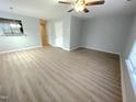 Bright living room boasts sleek wood floors, neutral walls, and a modern ceiling fan at 204 Allen St # A/B, Creedmoor, NC 27522