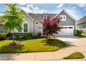 Charming home featuring a two-car garage, manicured lawn, and appealing curb appeal in a well-maintained neighborhood at 237 Abercorn Cir, Chapel Hill, NC 27516