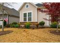 Landscaped front yard with a red Japanese maple, foundation planting, and a two story home at 237 Abercorn Cir, Chapel Hill, NC 27516