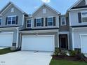 Attractive home featuring a two-car garage, neat landscaping, and stylish architectural details at 237 Shingle Oak Rd, Wake Forest, NC 27587