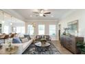 Bright and airy living room featuring modern furniture, hardwood floors, and plenty of natural light at 249 Spilona Way # 64, Four Oaks, NC 27524
