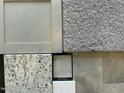 Close-up of home design materials showcasing carpet, tile, countertop, and cabinet samples at 249 Spilona Way # 64, Four Oaks, NC 27524