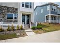 Well-maintained lawn with manicured landscaping leading to the inviting entrance with double-door entry at 249 Wendover Pkwy, Pittsboro, NC 27312