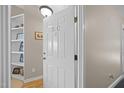 A welcoming entryway featuring a white door with the unit number and built-in shelving at 3471 Forestdale Drive # 3C, Burlington, NC 27215
