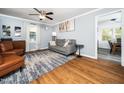Cozy living room featuring hardwood floors, neutral walls, and stylish furniture, perfect for relaxing or entertaining at 416 Avery St, Garner, NC 27529